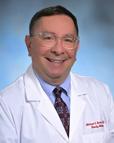 Professional headshot of Dr. Becker