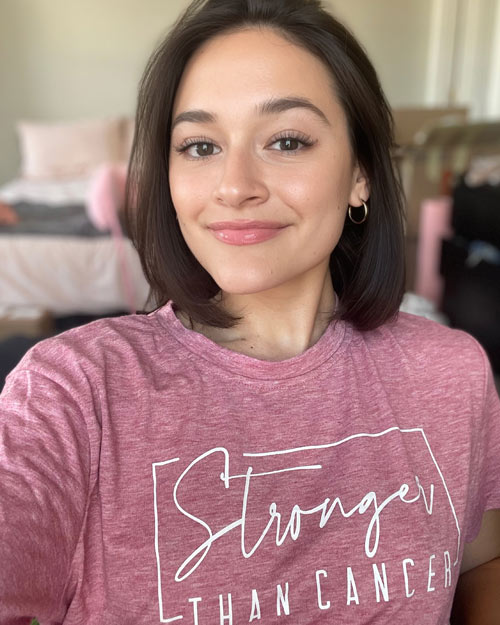 Angela wearing a t-shirt that reads, "Stronger than cancer"