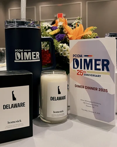 Various candles and place settings from the PCOM DIMER dinner event