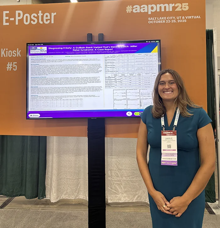 Gabrielle Horchos (DO ’26) stands next to her digital research poster at the American Academy of Physical Medicine and Rehabilitation Annual Assembly