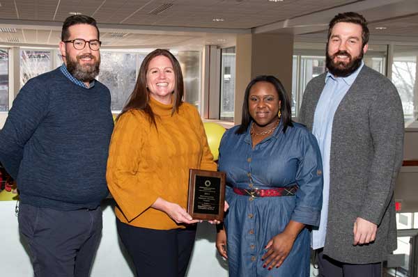 PCOM's mental health counseling faculty are shown with the PCA award.