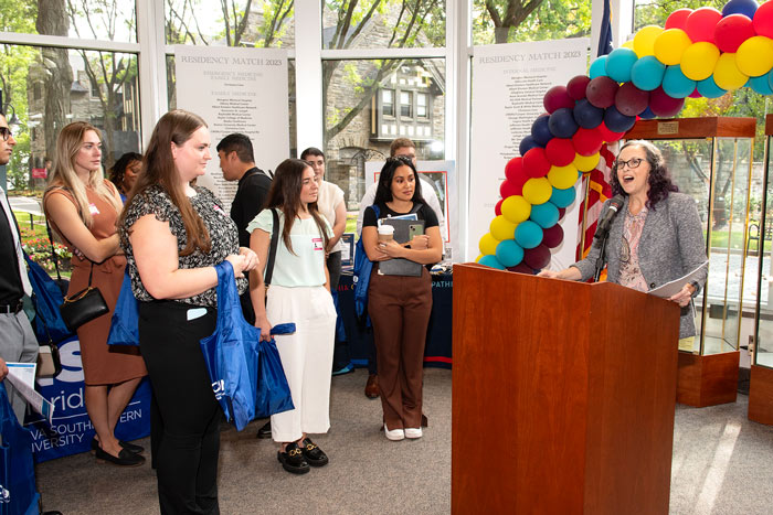 Kari Shotwell, Executive Director of Admissions at PCOM, addresses the crowd at the Osteopathic Medical School Expo