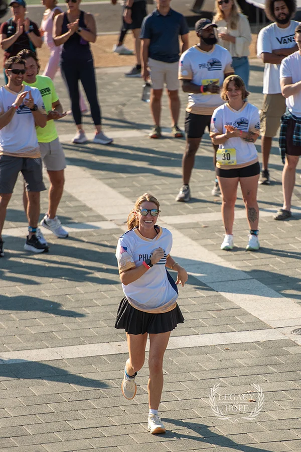 Counseling student Litman running during the PHL24 24-hour stair climb event at the Philadelphia Museum of Art’s Rocky steps
