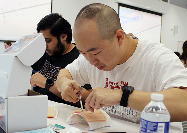 A PCOM South Georgia medical student practices suturing during the summer FIRE program to help med students transition into medical school