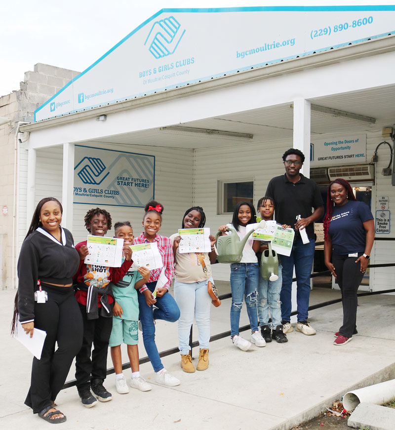 PCOM South Georgia DO students smiling with group of Boys and Girls Club children