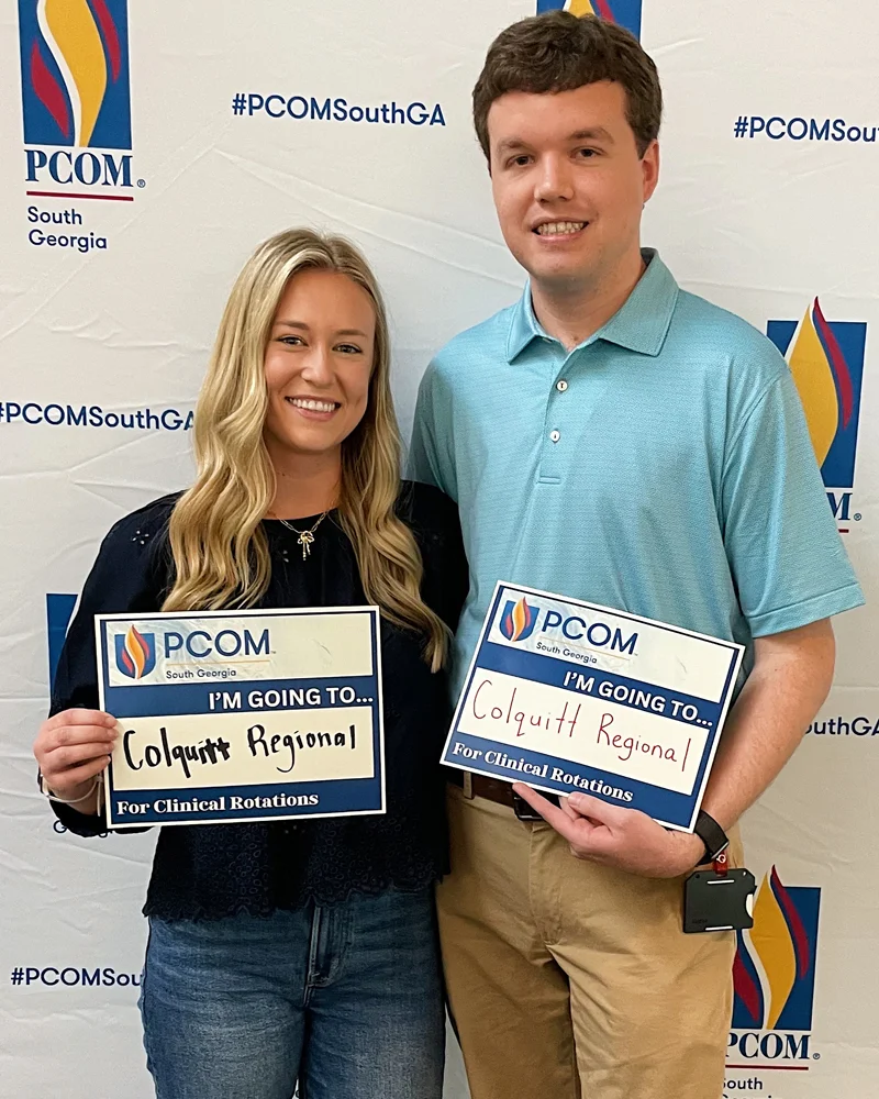 Emily Regin (DO '27) and Cole DeMott (DO '27) hold their Match Day signs