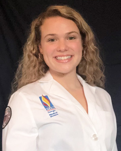 Headshot photograph of first year med student Evelyn White (DO '24) wearing her physician white coat