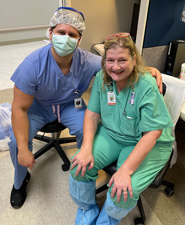 PCOM South Georgia medical student Griffin Clatt (DO '23) smiles with his OB-GYN rotation mentor Dr. Courson at SGMC.