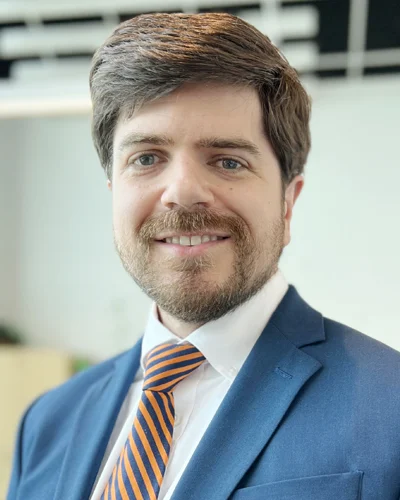 Professional headshot of Matthew L. Holt wearing blue suit