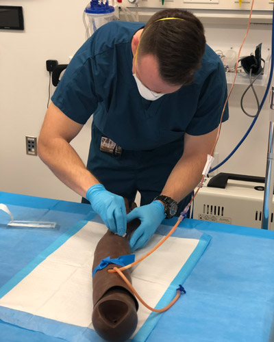 PCOM South Georgia osteopathic medicine student Trent Griner (DO ‘23) trains in the PCOM South Georgia simulation lab