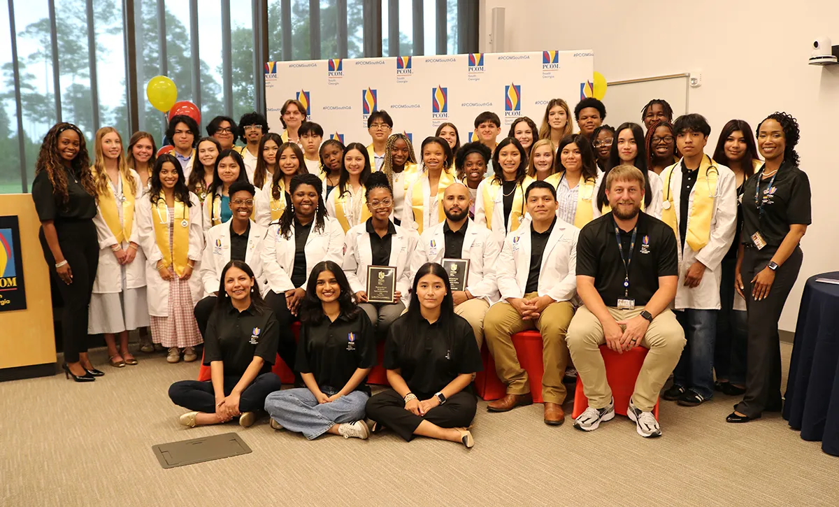 Group shot of Colquitt County teenagers as well as PCOM medical students and faculty during PCOM South Georgia's 2025 summer STEM and health careers camp