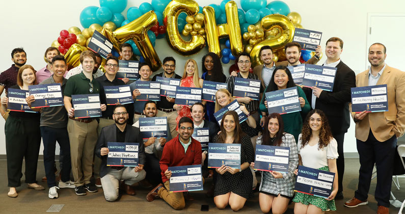 PCOM South Georgia's inaugural DO class pose for a group photo during a match day celebration