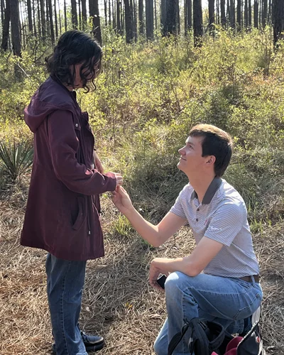 John Buford on one knee proposing to Kylie Parrish