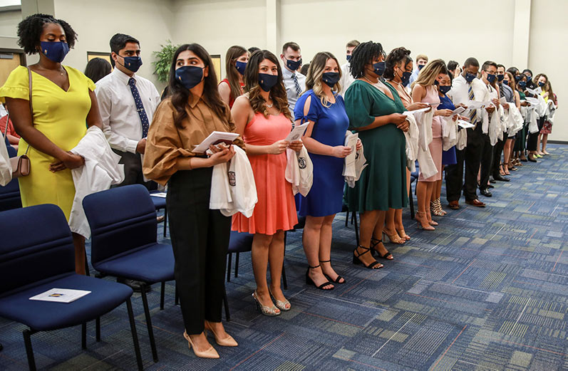 PCOM South Georgia medical students take an oath of patient care during the 2021 DO White Coat Ceremony