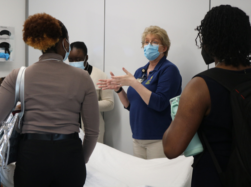 Instructor shows undergraduate students around the PCOM South Georgia campus