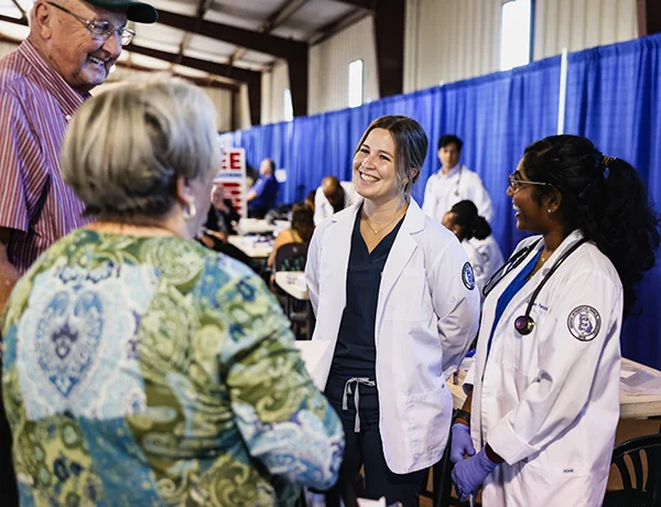 DO students talk to Ag Expo attendees