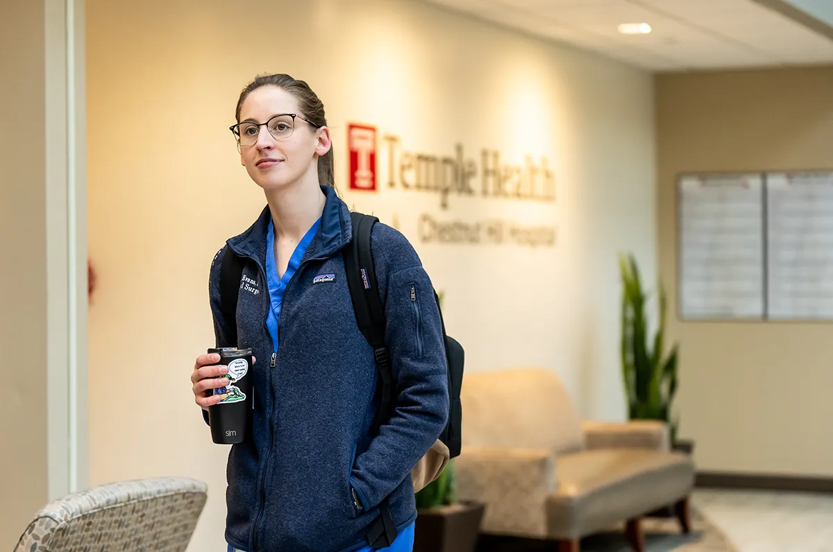 A PCOM resident walks through the lobby of Temple Health's Chestnut Hill Hospital