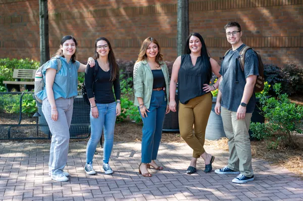 PCOM Georgia students stand in courtyard area