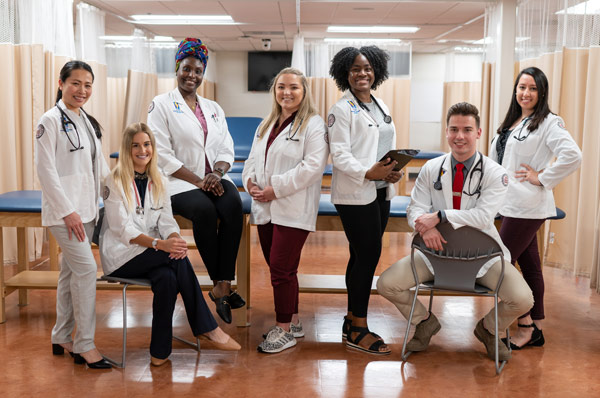 Physician assistant students smile in a group shot during a PCOM Georgia campus tour