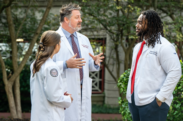 PCOM DO students and faculty talking on the Philadelphia campus during a campus tour event