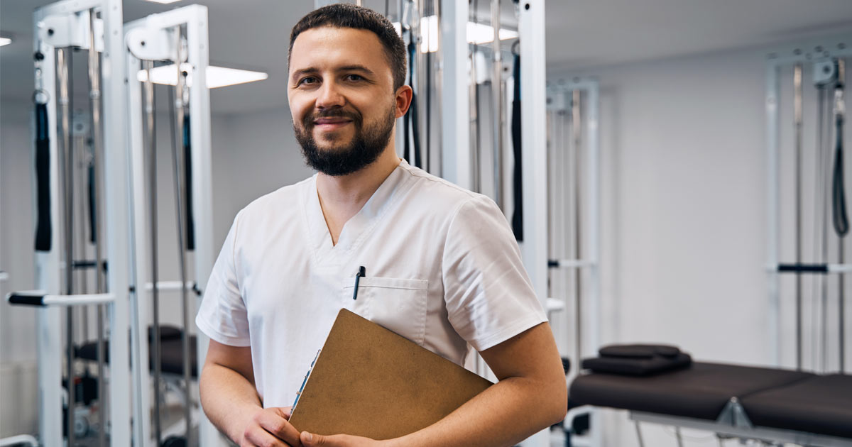 Physical therapy student smiling in a lab