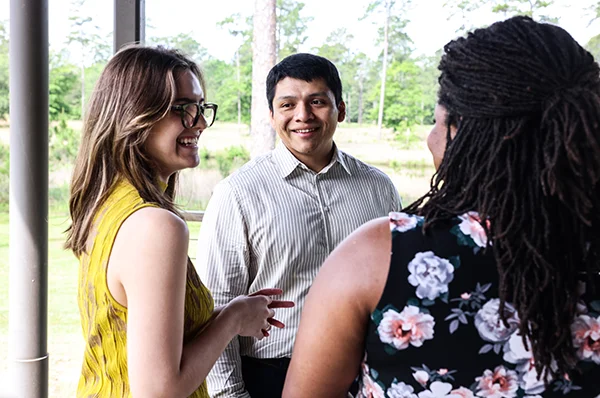 Students stand together in the Moultrie campus courtyard