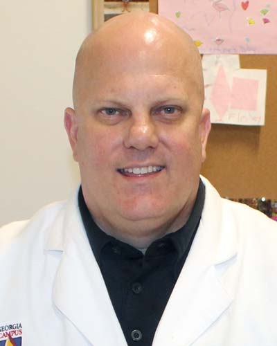 Headshot photograph of Christopher (Shawn) Holaway, PharmD