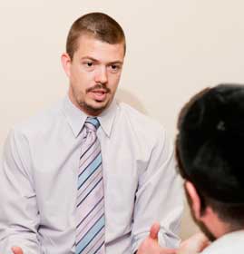 PCOM counseling student working with a standardized patient
