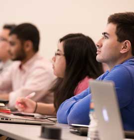 PCOM grad students taking certificate coursework in a classroom