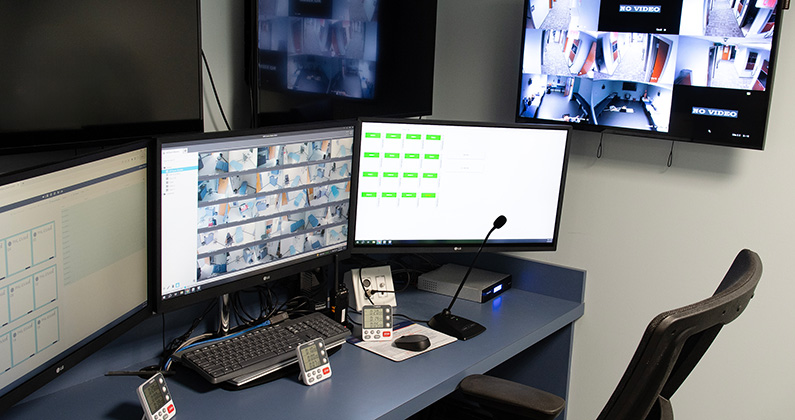 Control room with monitors, computers, keyboards and other equipment