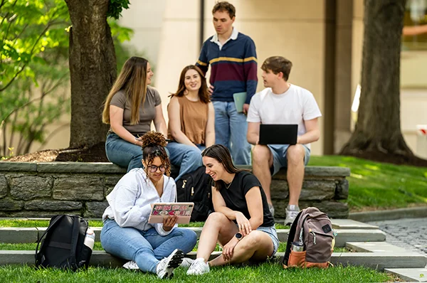 PCOM grad students studying outside during a sunny day on the Philadelphia campus