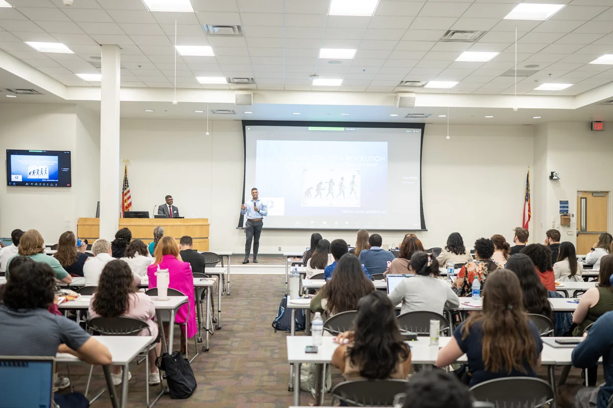 Students listening to a lecture in one of the classrooms at PCOM Georgia
