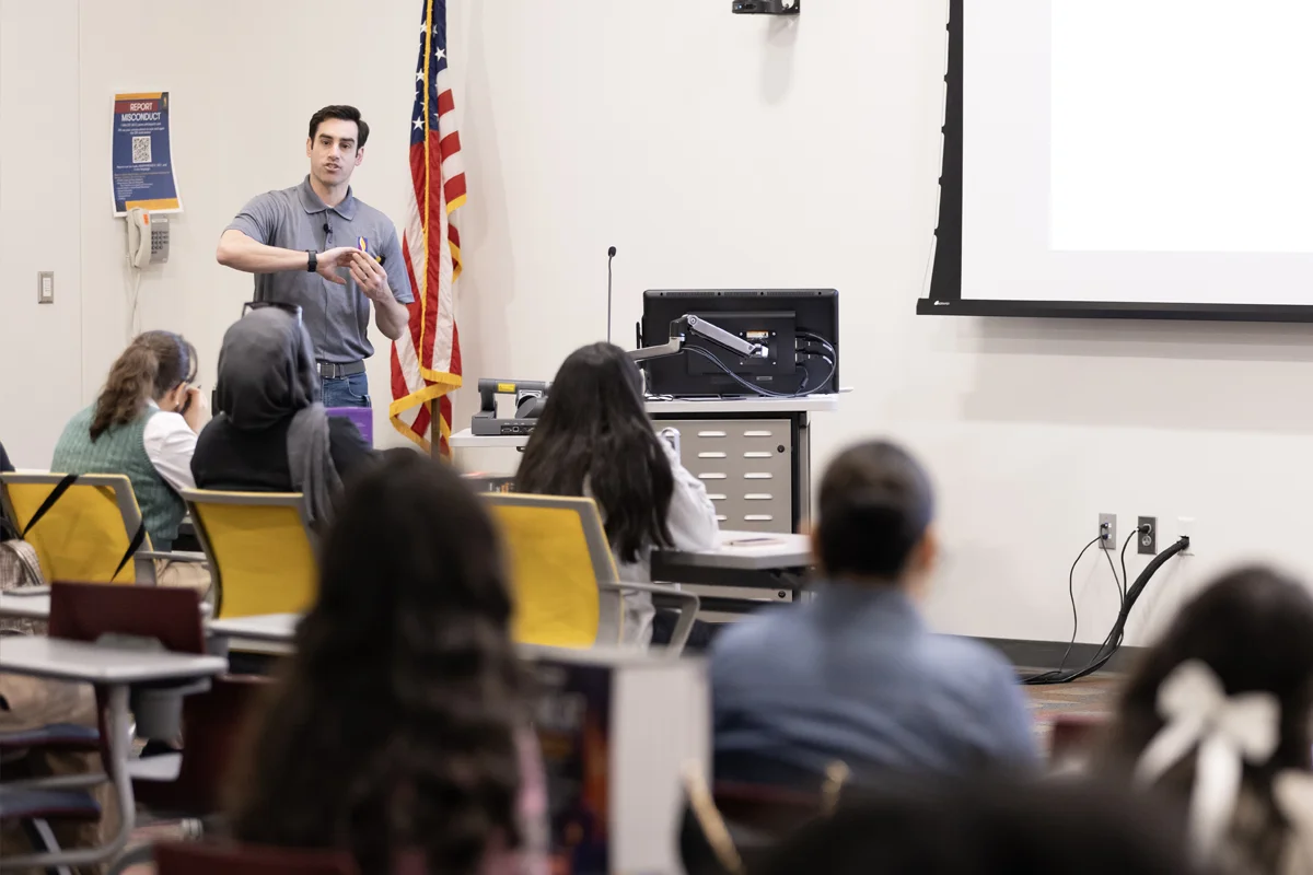 A student presenting in front of a classroom at PCOM Georgia