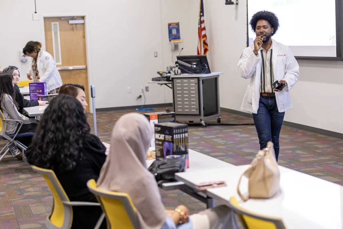 A student presenting in front of a classroom at PCOM Georgia