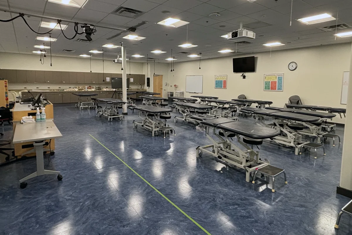 Wide shot of a Physical Therapy classroom and practice tables