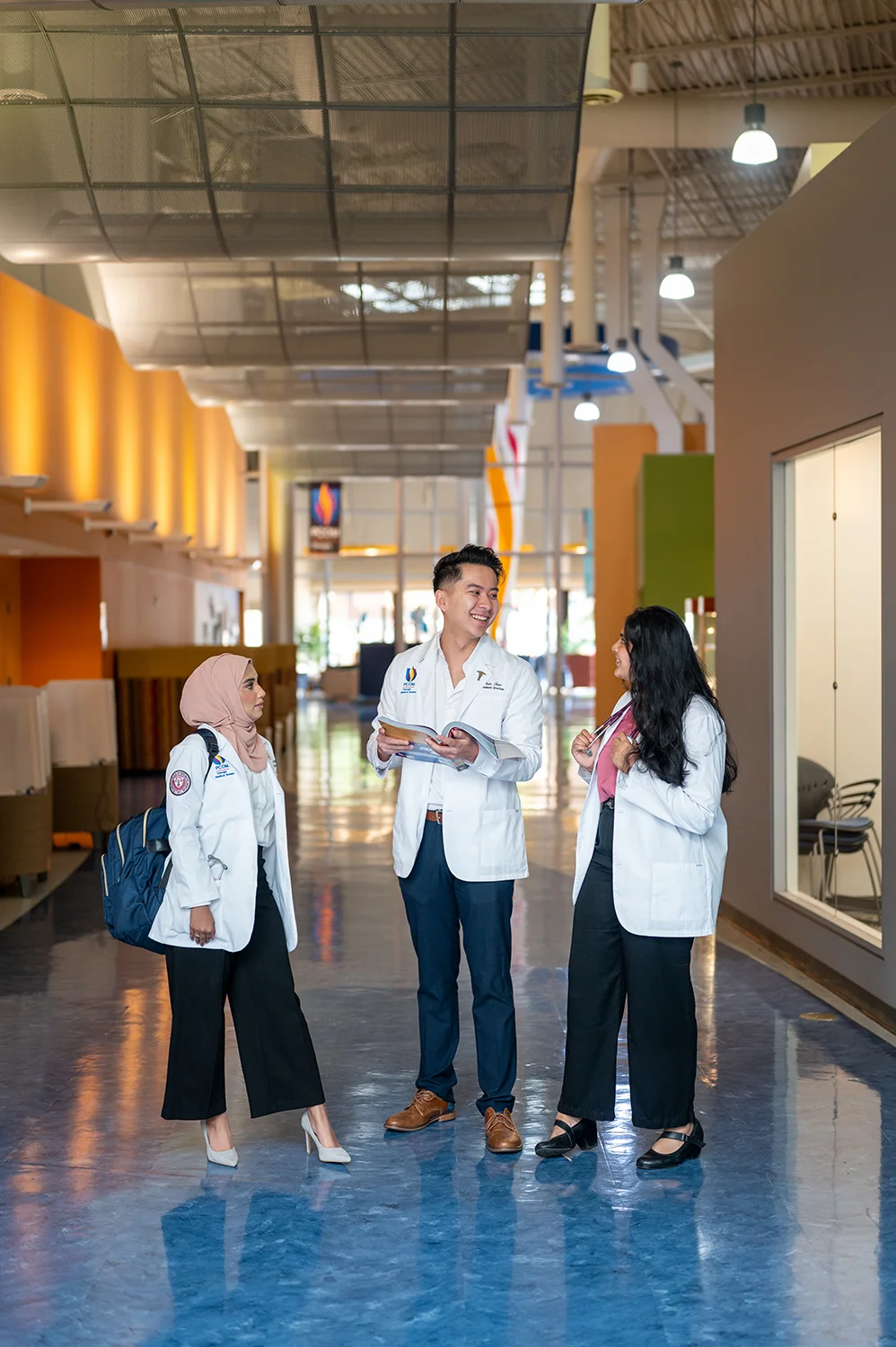 Students chatting in the main hallway