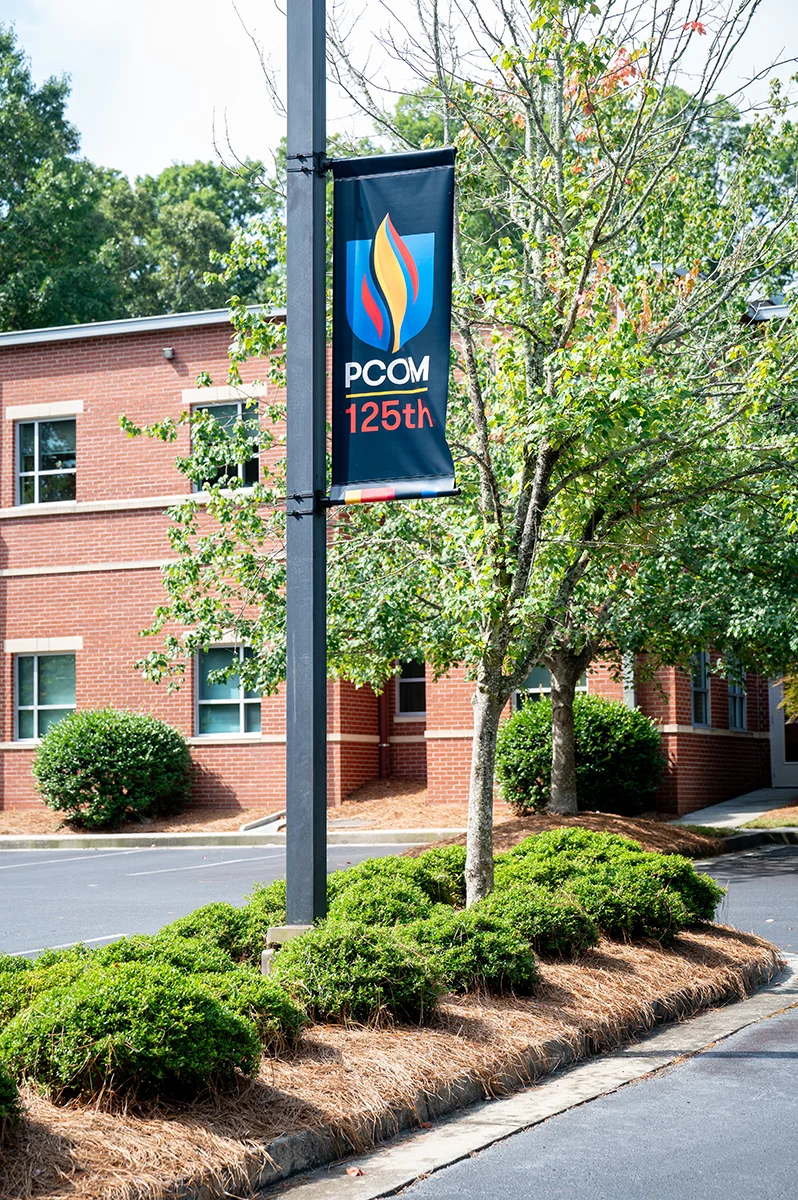 PCOM Georgia fabric banner on a lightpole in front of the Northlake building