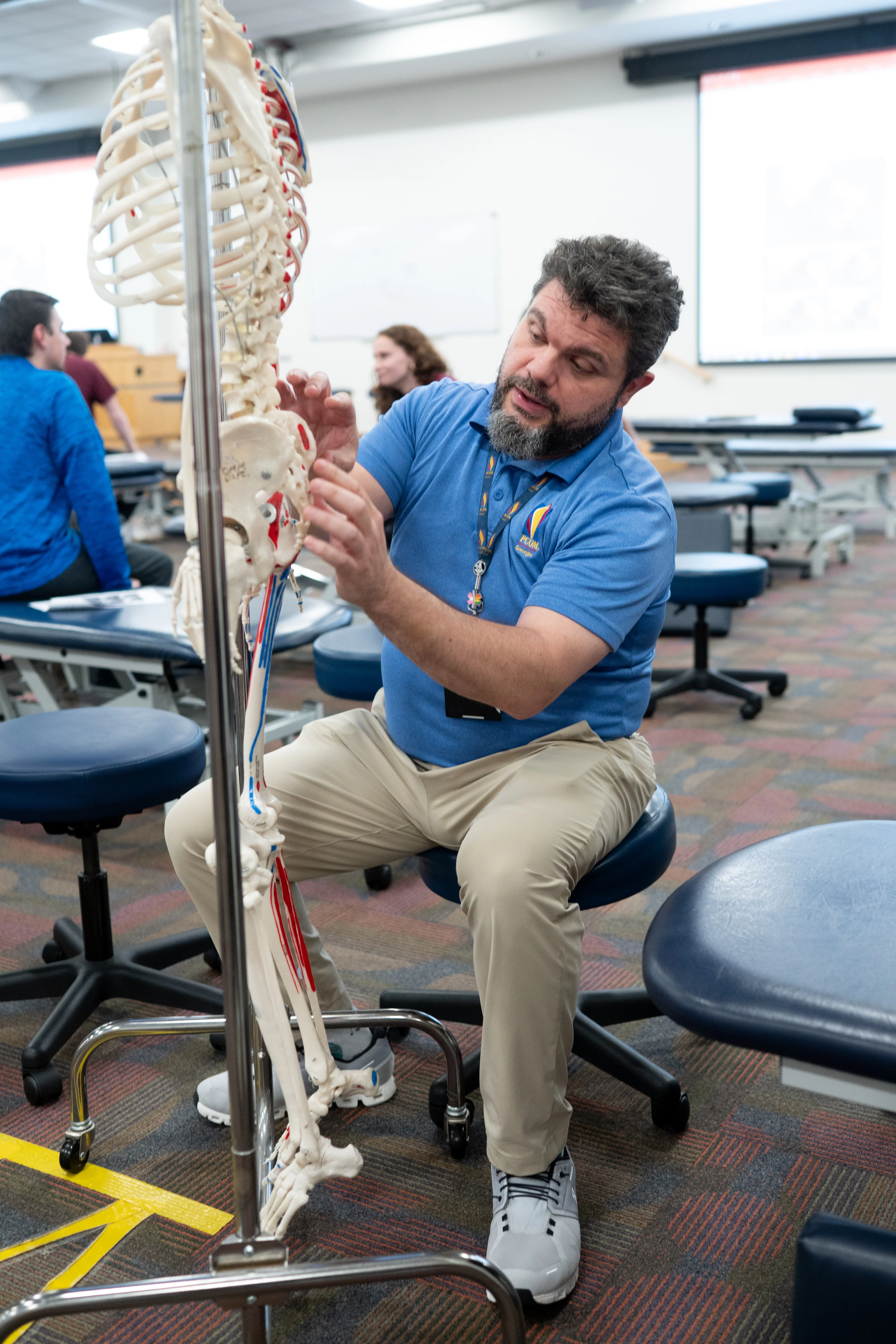 Dr. Yarri instructs PCOM med students during an OMM lab