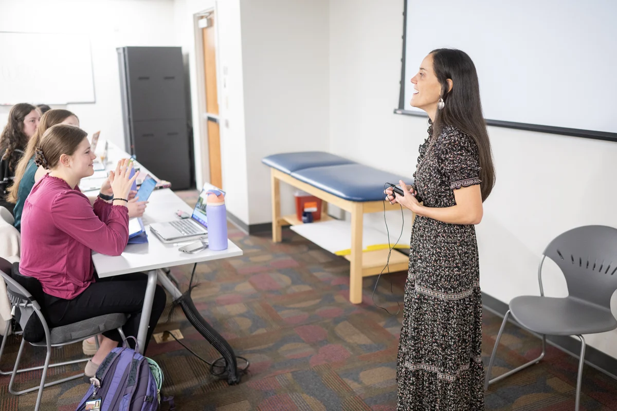 A PA Studies faculty member instructing a group of students in the Northlake Building classroom