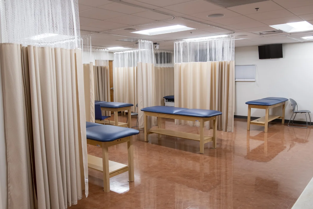 Exam tables and privacy curtains in the PA Studies Suite at PCOM Georgia