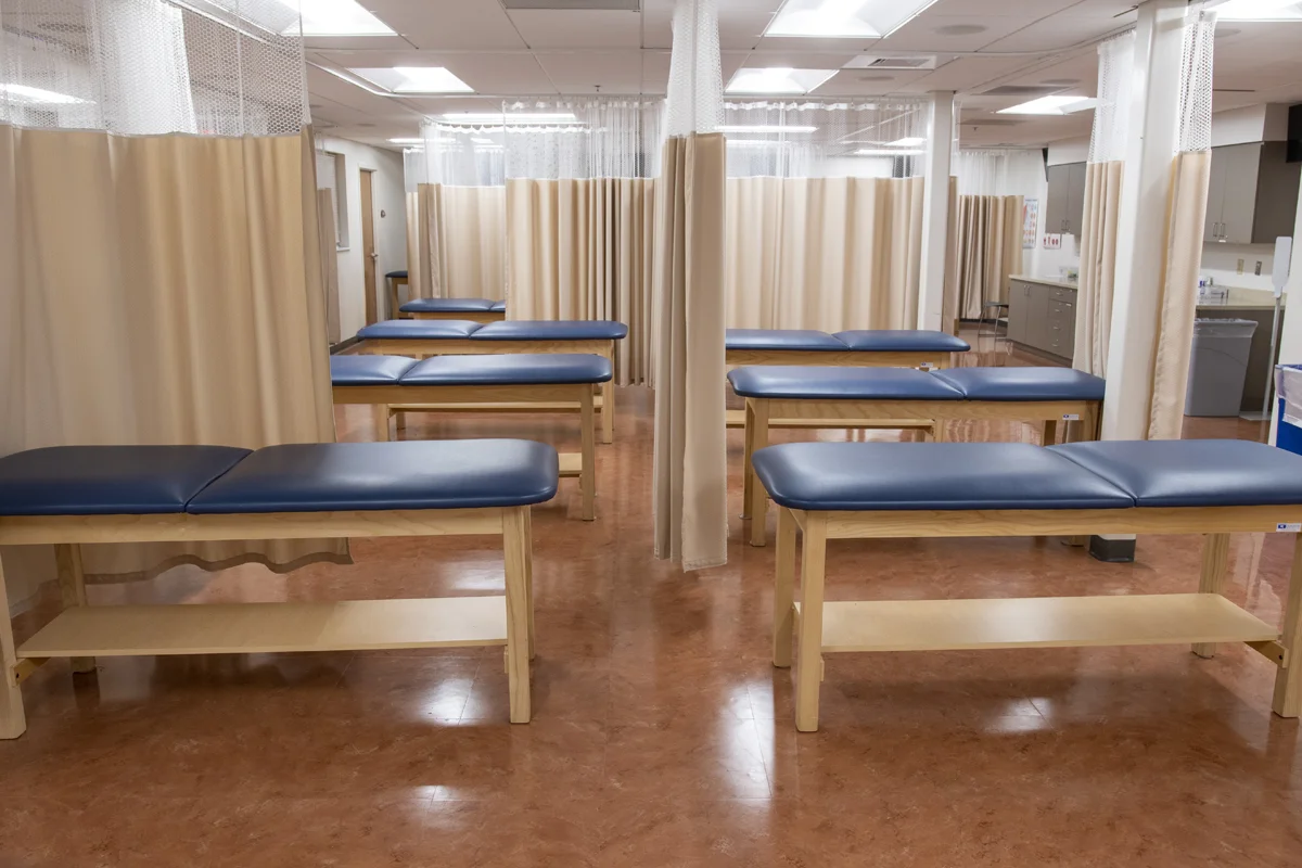 Exam tables and view of the clinical lab in the PA Studies Suite