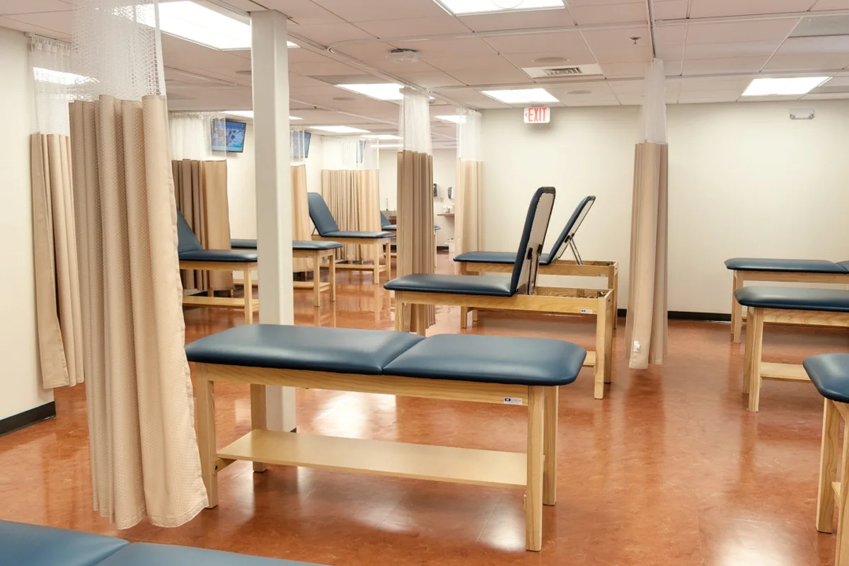 Open view of the rows of exam tables and patient training areas
