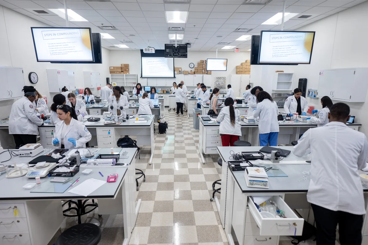 Wide view of PharmD students working in a pharmacy laboratory at PCOM Georgia