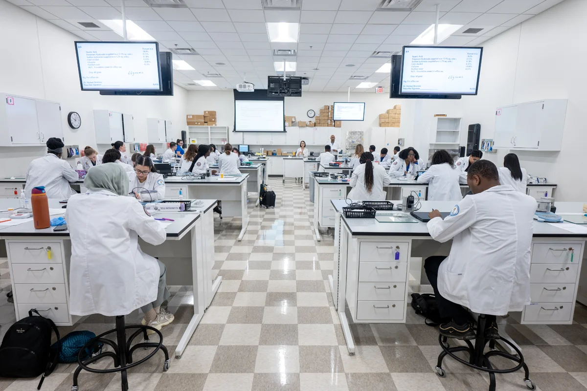 PCOM Georgia pharmacy students working in a laboratory assignment