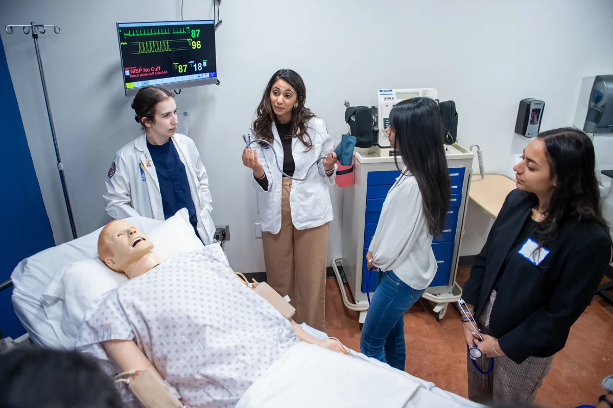 PCOM students conduct a trauma exercise on a simulation mannequin