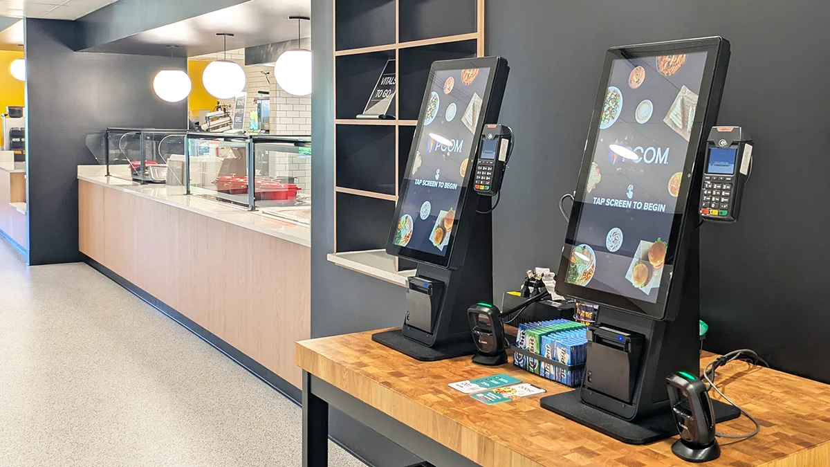 Grille and entree area and serving counter as well as digital pay kiosks in the PCOM Dining Commons