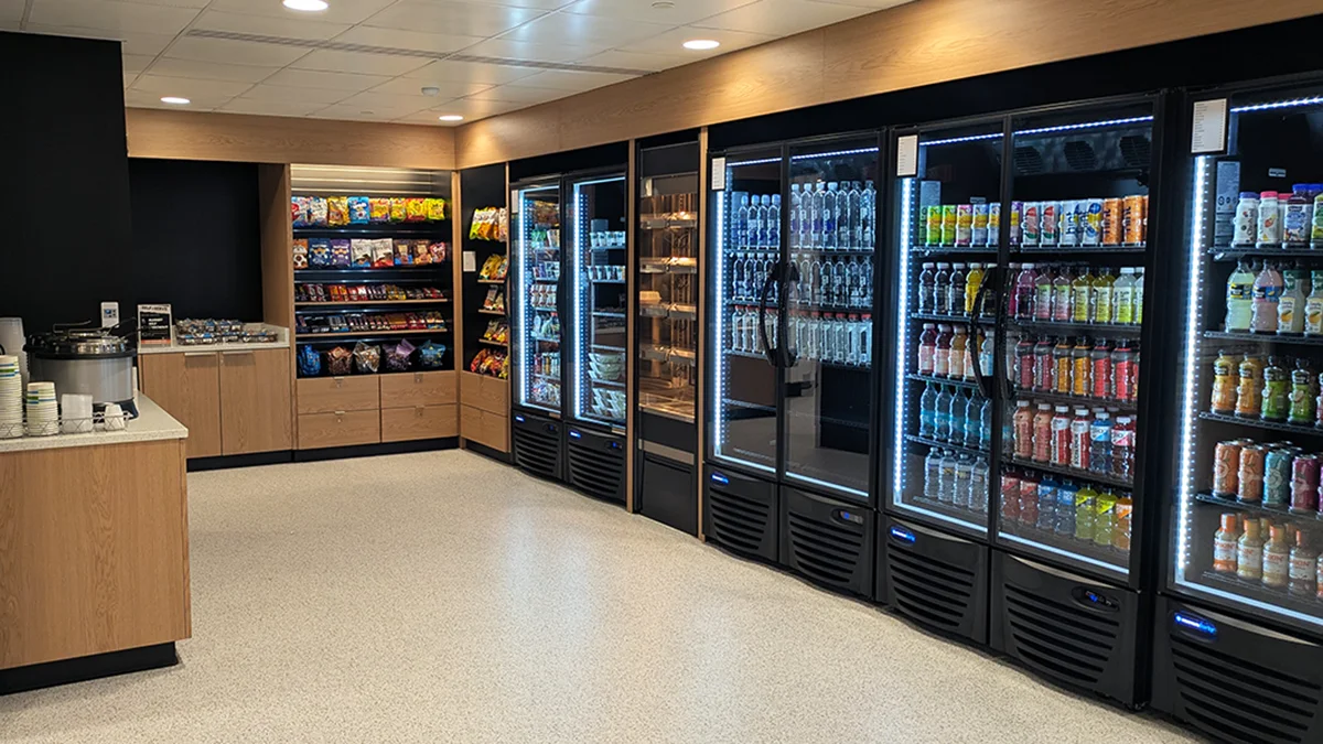 Refrigerated shelving and snacks to go in the 24/7 marketplace area
