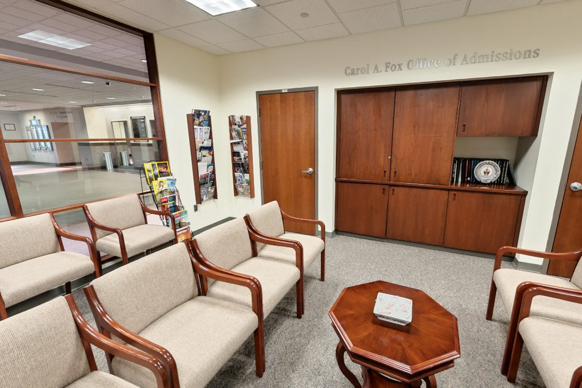 Empty wide view of the furniture and decorations in the Carol A. Fox PCOM Admissions Office