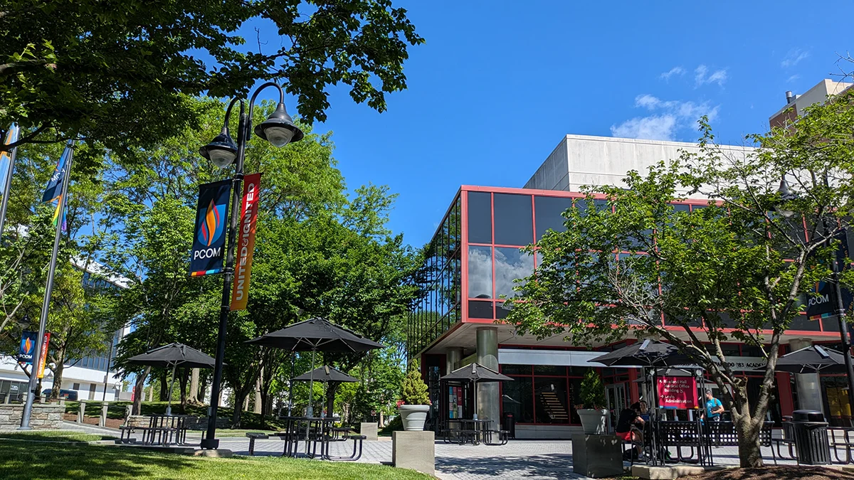 Front of PCOM's Hassman Academic Center building as viewed through the courtyard