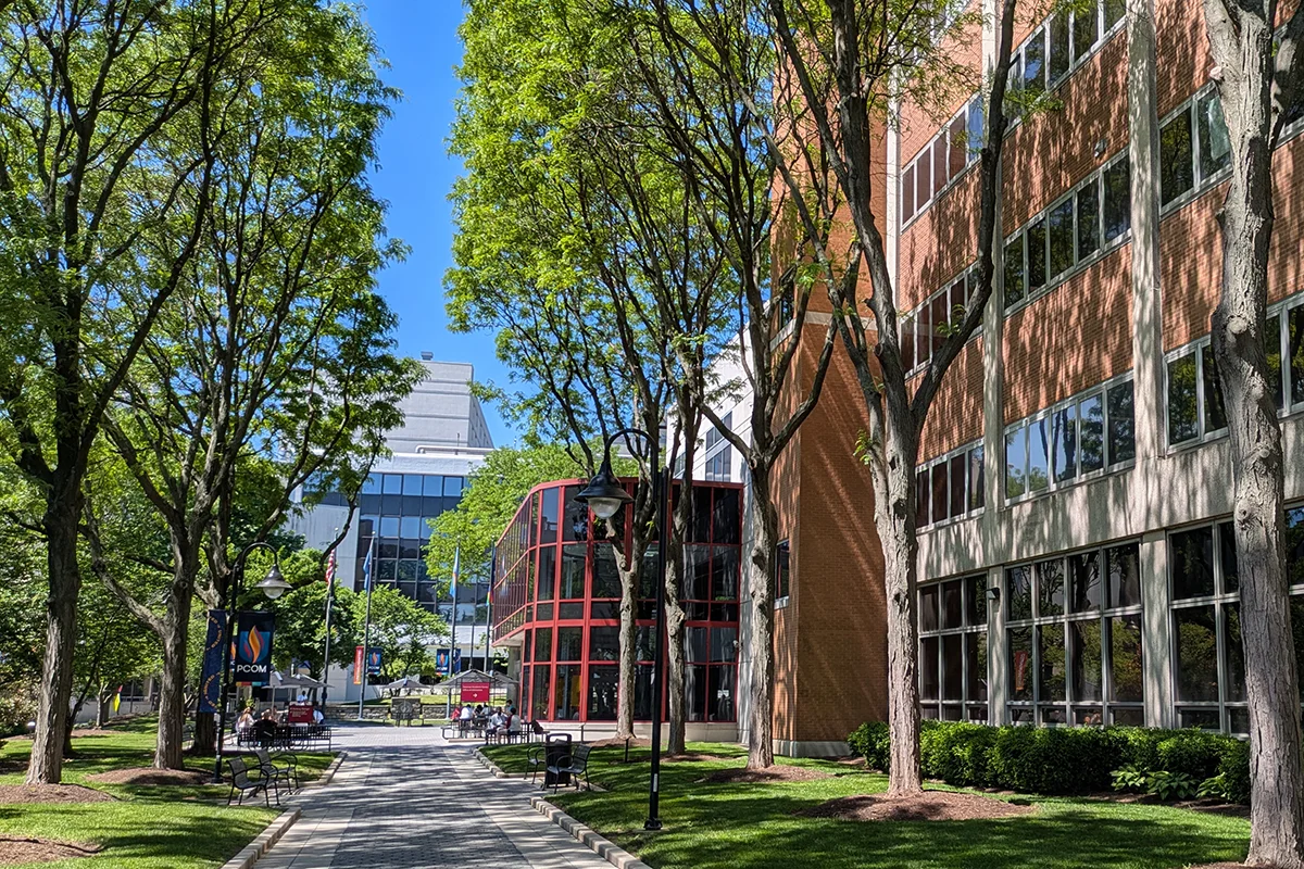 Side view of the Hassman Academic Center from the main pathway on PCOM's campus